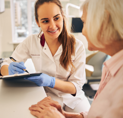 Doctor Berkal talking to a patient in the dental chair