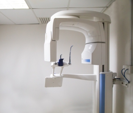 C T cone beam scanner against white wall in Derry dental office