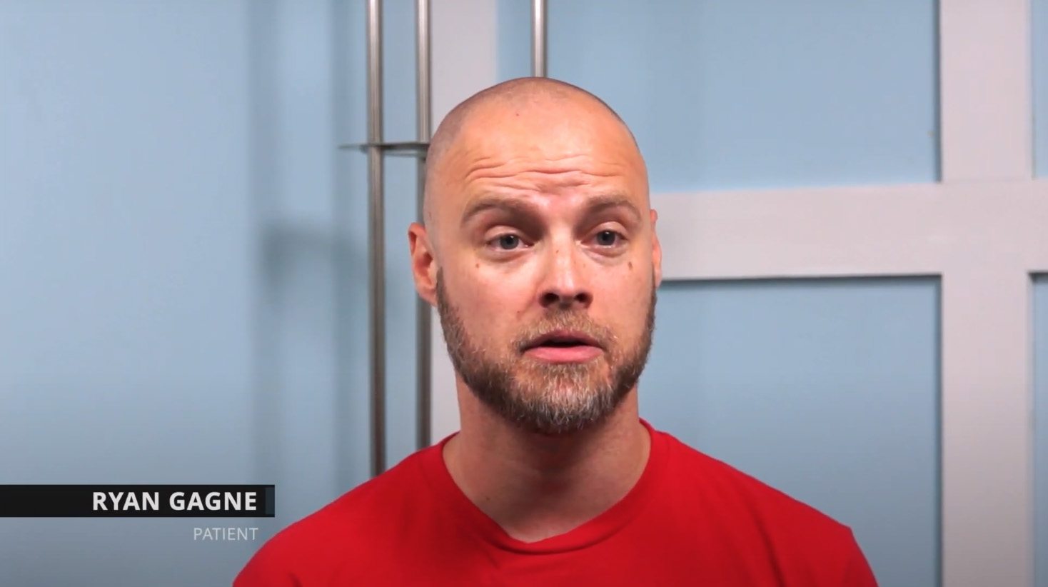 Man in red shirt with caption reading Ryan Gagne Patient