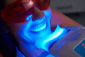 Woman getting her teeth whitened.
